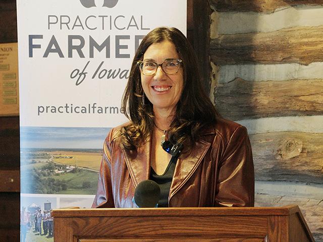 Ruth Rabinowitz accepts the 2025 Farmland Legacy Award in a Practical Farmers of Iowa celebration on Oct. 23 in Winterset, Iowa. (Photo courtesy of Practical Farmers of Iowa)